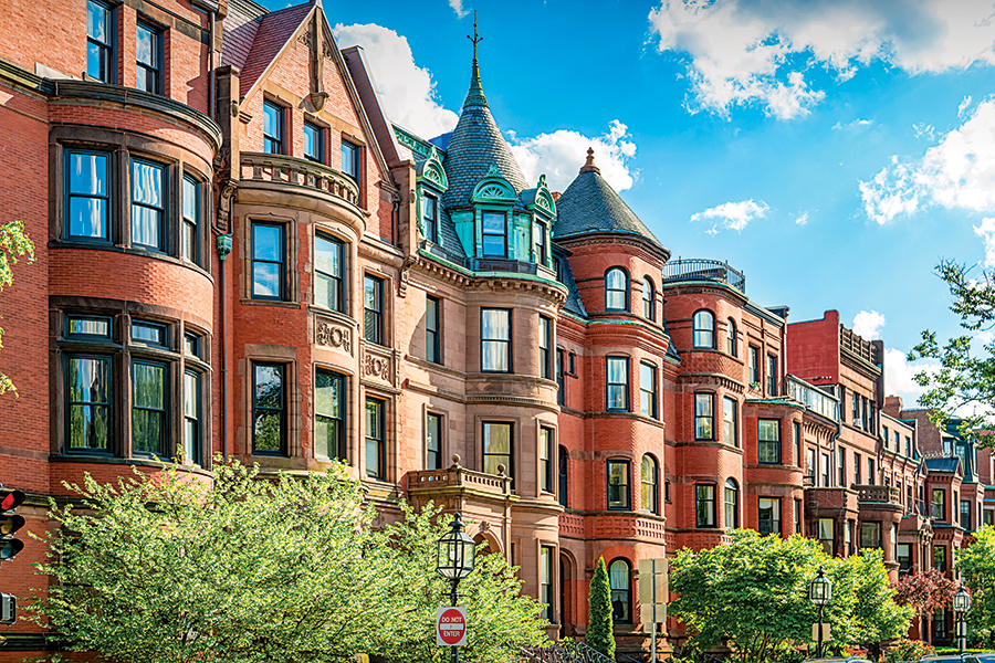 Typical brownstone townhouses in Back Bay district of downtown Boston, Massachusetts, USA on a sunny day.